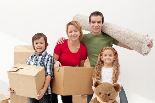 Expert packers preparing fragile items during a Pettswood move